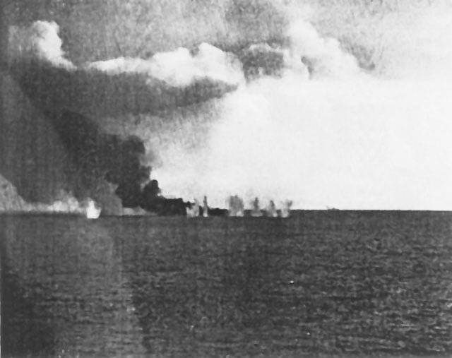 The burning Gambier Bay under attack during the Battle of Samar.