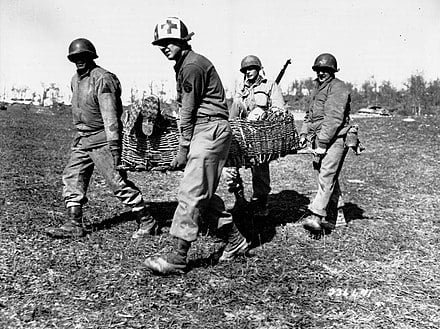Brazilian soldiers from the Brazilian Expeditionary Force transport a wounded man during the Battle of Montese